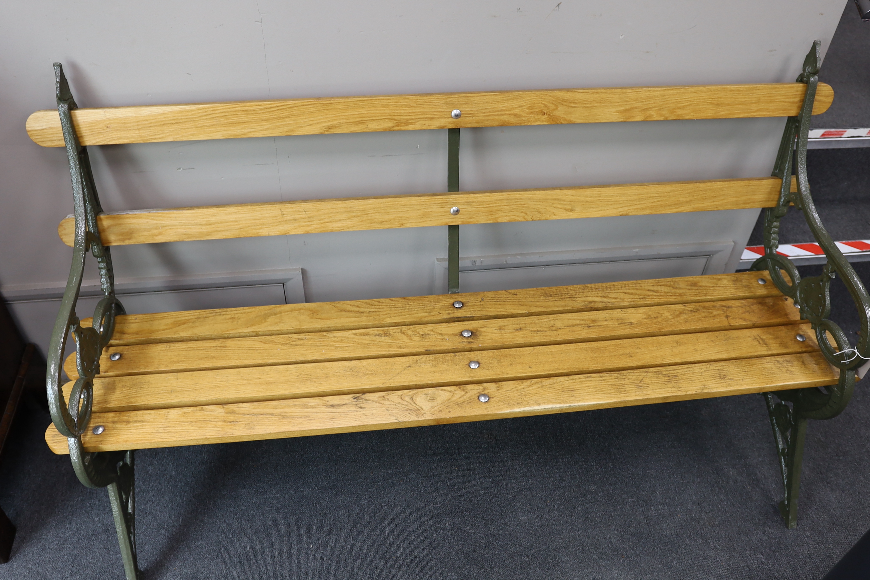 A Victorian Coalbrookdale 'lily pad' pattern cast iron garden bench restored with later ash slats, length 168cm, depth 54cm, height 93cm
